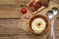 Homemade Thanksgiving garlic mashed potatoes with fresh tomatoes and pastrami. Sackcloth napkin, spoons, old wooden boards Royalty Free Stock Photo