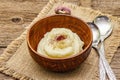 Homemade Thanksgiving garlic mashed potatoes with salt and pepper. Sackcloth napkin, spoons, old wooden boards background Royalty Free Stock Photo