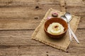 Homemade Thanksgiving garlic mashed potatoes with salt and pepper. Sackcloth napkin, spoons, old wooden boards background Royalty Free Stock Photo