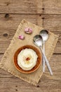 Homemade Thanksgiving garlic mashed potatoes with salt and pepper. Sackcloth napkin, spoons, old wooden boards background Royalty Free Stock Photo