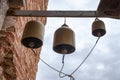 Homemade three bells in the Church for languages caught the ropes of the bells