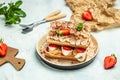 Homemade tiramisu cake with fresh strawberry, mascarpone and mint. Tiramisu portion on plate on light background. Delicious no Royalty Free Stock Photo