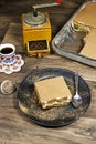 homemade tiramisu Italian dessert topped with coffee grinder, bean served on a black plate Royalty Free Stock Photo