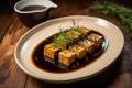 homemade tofu, soy sauce, and fresh herbs on a plate Royalty Free Stock Photo