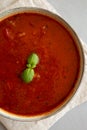 Homemade Tomato Basil Soup in a Bowl, top view. Flat lay, overhead, from above. Close-up Royalty Free Stock Photo