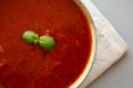 Homemade Tomato Basil Soup in a Bowl, top view. Flat lay, overhead, from above. Close-up Royalty Free Stock Photo