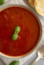 Homemade Tomato Basil Soup in a Bowl, top view. Flat lay, overhead, from above. Close-up Royalty Free Stock Photo