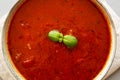 Homemade Tomato Basil Soup in a Bowl, top view. Flat lay, overhead, from above. Copy space Royalty Free Stock Photo