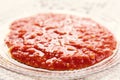 Homemade tomato sauce in a glass plate closeup. horizontal view Royalty Free Stock Photo