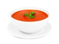 Tomato soup in a white bowl with saucer isolated on white Royalty Free Stock Photo