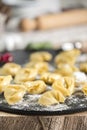 homemade Tortelli Tortellini stuffed over a black stone ardesian tray