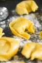 homemade Tortelli Tortellini stuffed over a black stone ardesian tray