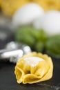 homemade Tortelli Tortellini stuffed over a black stone ardesian tray