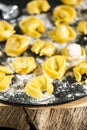 homemade Tortelli Tortellini stuffed over a black stone ardesian tray