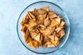 Homemade Tortilla Chips made with Flatbread in Glass Bowl and Baked in Oven.