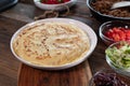 Homemade tortillas with meat and ingredients on a wooden table Royalty Free Stock Photo
