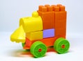 Homemade train of multi-colored cubes on a white background