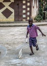 Homemade toys entertain youngster in rural Haiti.