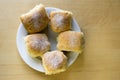 Homemade traditional Czech buns stuffed with plum jam, raisins and cottage cheese on white plate on the table Royalty Free Stock Photo