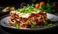 Homemade traditional Italian lasagna on a plate garnished with fresh herbs ready to be served for a hearty meal Royalty Free Stock Photo