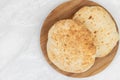 Homemade traditional lepinja bread on the wooden board Royalty Free Stock Photo