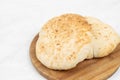 Homemade traditional lepinja bread on the wooden board Royalty Free Stock Photo