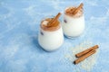 Homemade traditional mexican or spanish cool rice Horchata in a glass on blue background. Fresh cool drink or cocktail made from Royalty Free Stock Photo