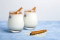 Homemade traditional mexican or spanish cool rice Horchata in a glass on blue background. Fresh cool drink or cocktail made from Royalty Free Stock Photo