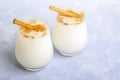 Homemade traditional mexican or spanish rice Horchata in a glass on blue background. Fresh cool summer drink or cocktail made from Royalty Free Stock Photo