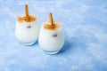 Homemade traditional mexican or spanish rice Horchata in a glass on blue background. Fresh cool summer drink or cocktail made from Royalty Free Stock Photo