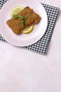 Homemade traditional Milanese veal escalope with french fries