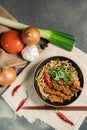 Homemade traditional taiwanese pork noodle with pork broth and seasoning with spicy,tomato,onion,leek,garlic and ginger