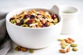 homemade trail mix in a white ceramic bowl Royalty Free Stock Photo