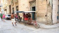 Homemade tricycle. The old streets of Havana.