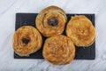 Homemade turkish acma with nigella seeds. Freshly backed swirl buns. With cheese, with potatoes acma, with spinach acma, with