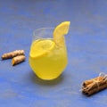 Homemade turmeric-ginger iced tea with cinnamon and lemon Royalty Free Stock Photo