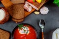 Homemade Ukrainian national soup - red borscht made of beetrot, vegetables and meat with brown bread, garlic, pepper Royalty Free Stock Photo