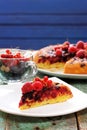 Homemade upside down berry cake with fresh raspberries and currants