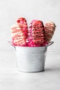 Homemade Valentine cakesickles in a metal pail, against a light background. Royalty Free Stock Photo