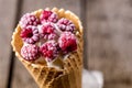 Homemade Vanilla Ice Cream in Waffle Cone with Frozen Raspberry Lying on on Rustic Wooden Background Tasty Ice Cream Summer Royalty Free Stock Photo