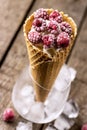 Homemade Vanilla Ice Cream in Waffle Cone with Frozen Raspberry Lying on on Rustic Wooden Background Tasty Ice Cream Summer Royalty Free Stock Photo