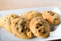 Homemade vanilla, orange, lemon chocolate chip cookies biscuits stack on a white plate