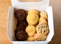 Homemade vanilla, orange, lemon chocolate chip cookies biscuits stack on a white plate