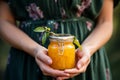 Homemade vegan apricot jam held in gentle hands a jar of pure goodness