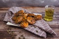 Homemade vegan pumpkin scones with thyme and seeds on wooden table with herbal tea Royalty Free Stock Photo