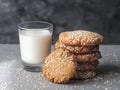 Homemade Vegan Tahini Cookies in stack with glass of milk