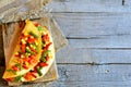 Homemade vegetable stuffed omelette on wooden background with copy space for text. Eggs omelette