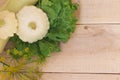 Homemade vegetables. Squash Squash white and lettuce on a wooden background. Green harvest on wooden background. Courgettes on a