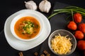 Homemade vegetarian tomato cream soup in white bowl on wooden table Royalty Free Stock Photo