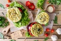 Homemade veggie burger with beetroot cutlet, spinach bun and vegetables top view on wooden background Royalty Free Stock Photo